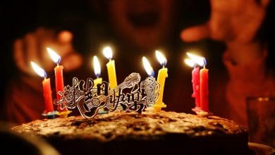 a boy celebrates his birthday with a cake.