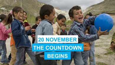 a group of children playing in a village. One boy is holding a blue ball. On the photo are the words 20 November. The countdown begins.