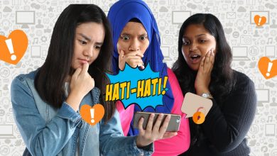 Three girls look down at a phone with shocked and worried look