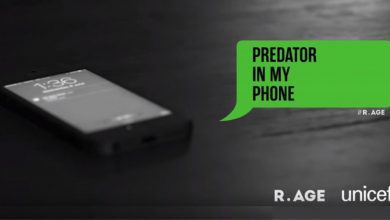 a phone on a table. Next to it a speech bubble with the words Predator in my phone. Below are the R.AGE and UNICEF logos.