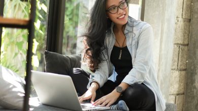 young woman sitting at her laptop.