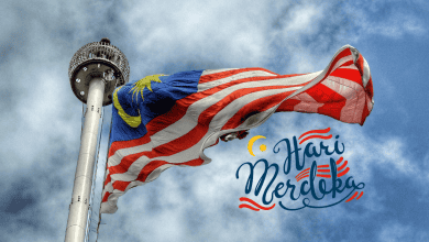 Malaysian flag flying proudly reflecting Malaysian democracy. At the bottom are words "Hari Merdeka".